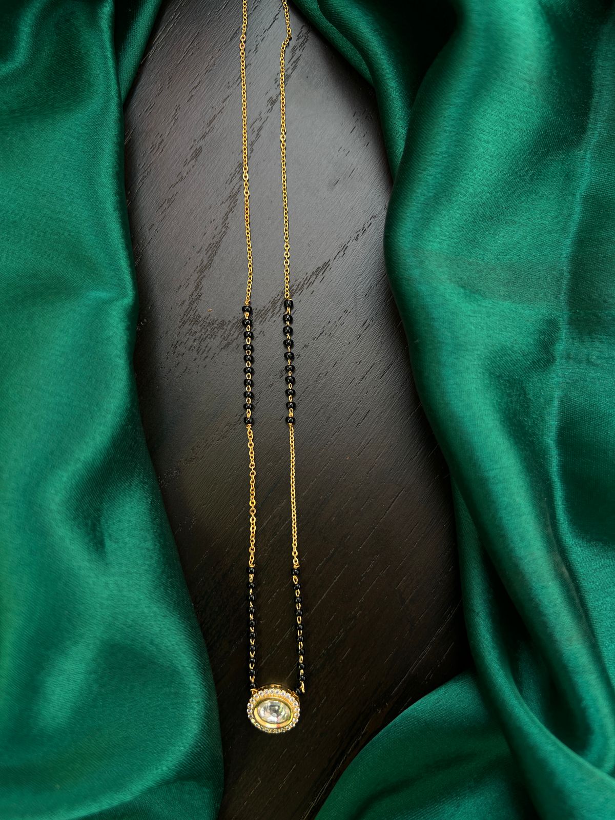 Black beads with mossonite locket