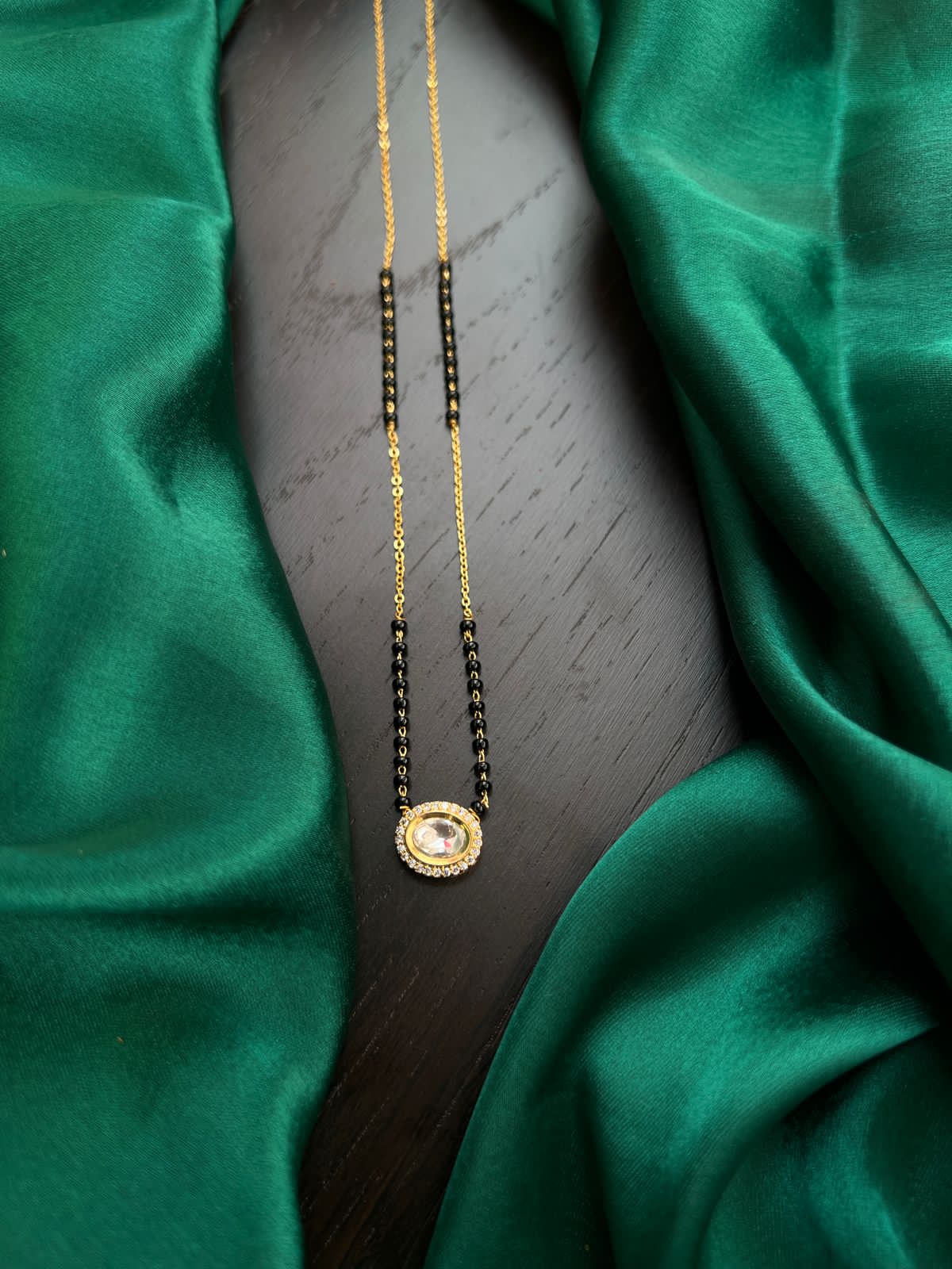 Black beads with mossonite locket