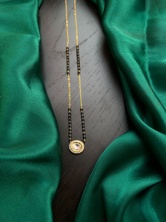 Black beads with mossonite locket